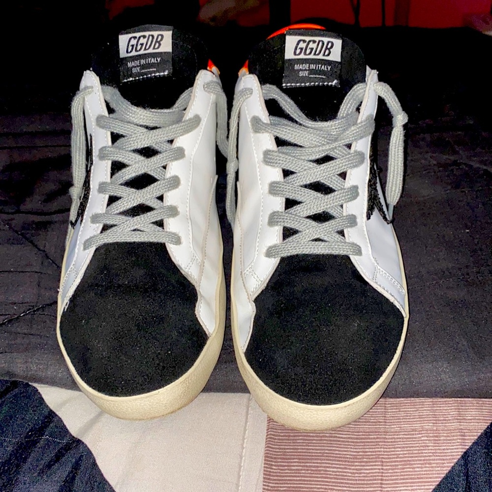 Orange heel tab White based and black star